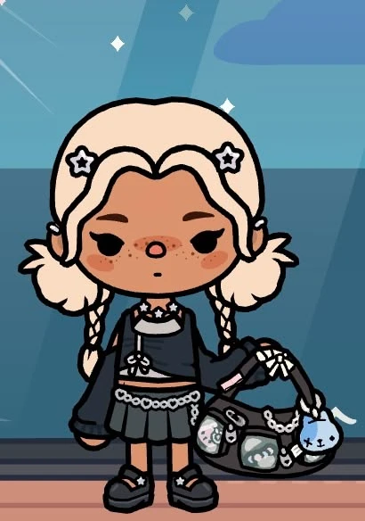 Star-clipped white braids with cropped top and chain mini skirt